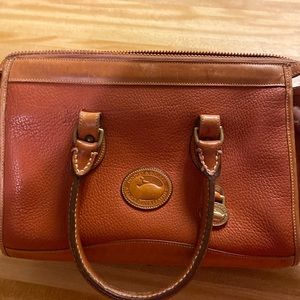 Brownish rust colored dooney and bourke